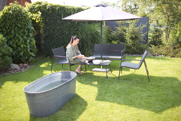 Woman cooking in her backyard