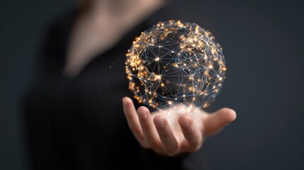 A hand holds a glowing, interconnected globe (1)