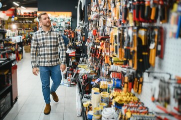 Portrait of mature man standing in hardware store