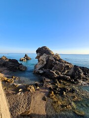 evocative image of an italian beach at sunset