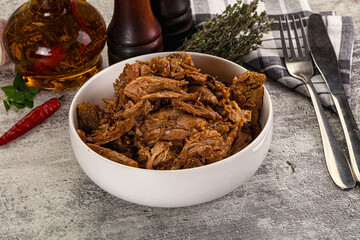 Shredded slow cooked pork meat
