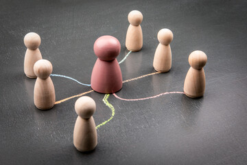 Leadership and influence concept with central figure connected to group by chalk lines