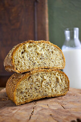 Rustic artisan bread photography series showing stacked loaves, sliced bread with milk, and country-style food compositions on wooden backgrounds, highlighting organic bakery and farmhouse lifestyle