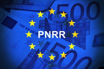 European Union flag and euro cash bills with the sign Pnrr.