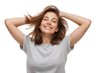 Radiant woman joyfully tosses her hair, exuding confidence and happiness with a carefree attitude