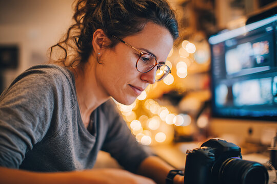 Creator conducts product review in cozy workspace filled with warm lights and tech gear