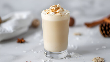 Savor a creamy, spiced winter beverage topped with whipped cream and cinnamon, perfect for cozy holidays and festive gatherings