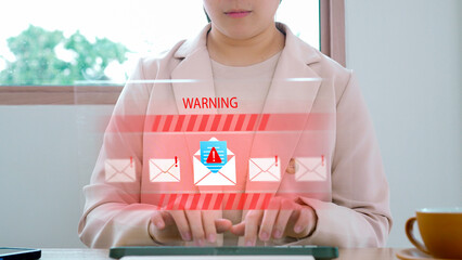Businesswoman receiving a cybersecurity warning about a phishing email scam and malware attack on a futuristic holographic interface, illustrating a data breach and internet security threat.