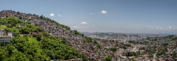 Favela de rioa at dawn with the famous Christ the Redeemer in the background
