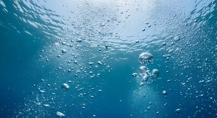 Abstract image of a dynamic stream of bubbles rising from the depths of the ocean.

