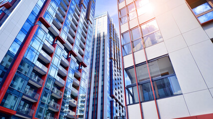 Fototapeta na wymiar Modern new residential apartment house building complex. Exterior view of modern apartment building. New construction apartment or condo complex.
