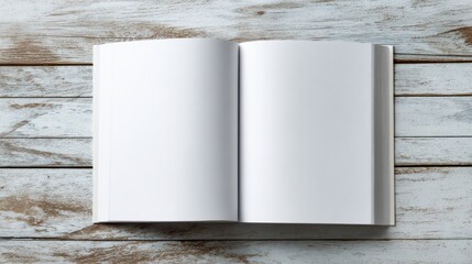 High definition photo of blank book cover template with an open page on the front side positioned on a white wood background in a flat lay copy space image.