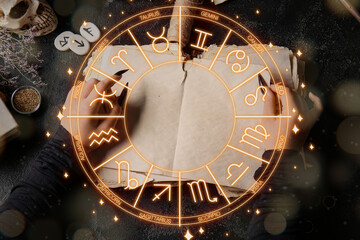 Witch with spell book on dark background