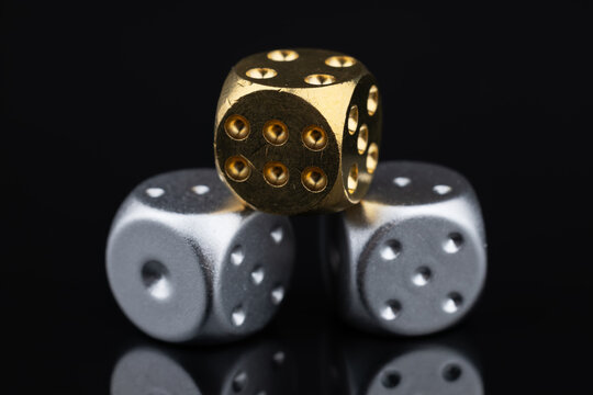 Random number generator. Three dice with numerical values lie in a chaotic order