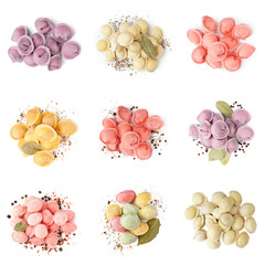 Set of colorful raw dumplings on white background, top view