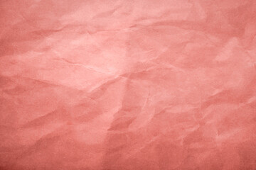 Fototapeta premium Crumpled coral paper sheet, closeup