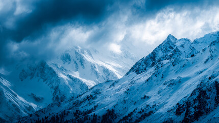 Majestic snow-covered mountain range under stormy sky
