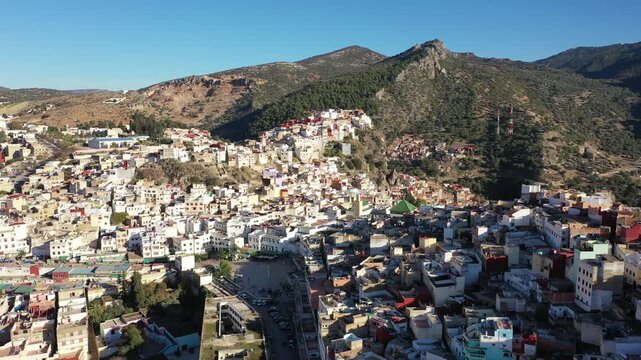The Mausoleum of Moulay Idriss in Zerhoun, Morocco, is a sacred site honoring the founder of the Idrisid dynasty, attracting pilgrims for its religious and historical significance.