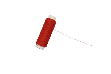 red thread spool with needle isolated