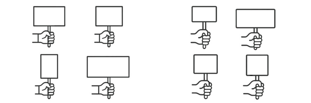 Hands holding blank signs for protest or announcement purposes