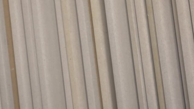 Stack of drywall sheets arranged in a neat formation, showcasing texture and color variations, emphasizing construction material details and organization. stack of drywall . selection assortment
