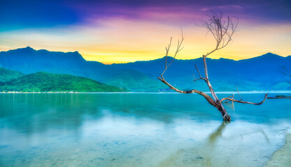 Lap An Lagoon in sunset sky is a brackish water lagoon located on the shore of Lang Co Bay, Hue City. This is one of 12 typical lagoons of Central Vietnam.