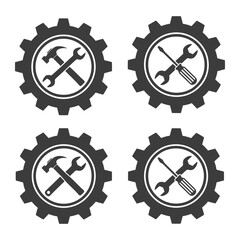Four black gears containing crossed hammer and wrench or screwdriver and wrench on white background vector