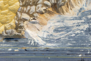 Aerial view of textured piles of earth casting shadows across the landscape, a study in contrasts and tones, Graz, Styria, Austria.