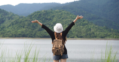 Happy young woman travel relax in the holiday. Travel hiking. Travel and wanderlust concept. Nature tourism in Nakhon Nayok Province. Thailand.