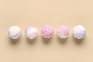 Row of different bath bombs on color background
