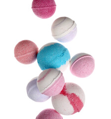 Different bath bombs flying on white background