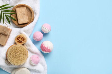 Composition with spa accessories and bath bombs on color background