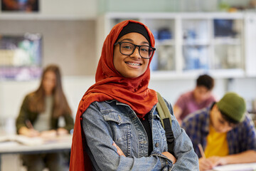 Portrait of confident islamic girl student smiling in secondary school © Rido
