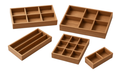 Assorted empty wooden drawer organizers with compartments.