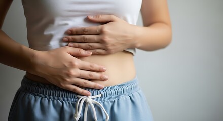 Woman holding her stomach