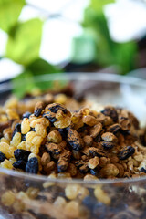 Glass container with date and nut blend for raw vegan desserts