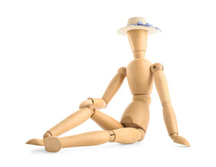 Wooden mannequin in straw hat sitting on white background