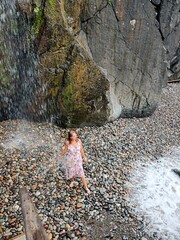 Young woman and waterfall in Batumi tsikitdziri