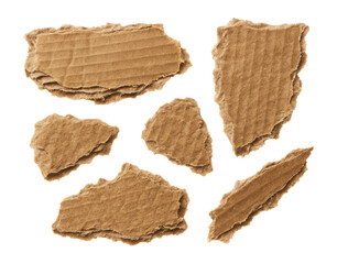 Torn cardboard paper pieces with crumbled texture.