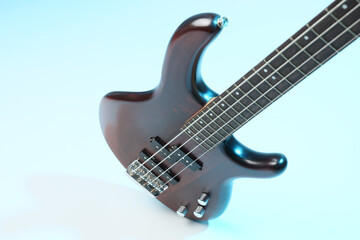 Electric guitar on blue background, closeup