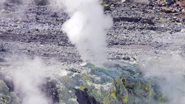 A volcano crater with an acid lake (explosion lake) and steaming fumaroles (solfatare) and hot springs. Sulawesi. Indonesia