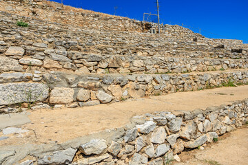 A stone wall with a stone staircase leading up to it, amphitheater. Ruins of the ancient city of Philippi, Greece