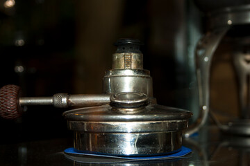 Coffee grinder on a bar counter in a coffee shop