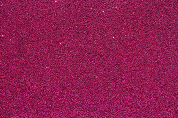 A close up of a pink background with a lot of glitter