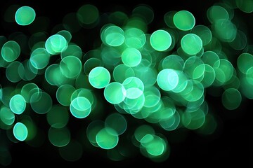 Abstract bokeh background of vibrant green circles