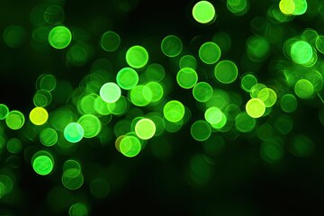 Abstract bokeh lights, vibrant green circles on black background