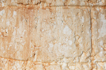 Vintage aged wall with texture showing effects of weather and time. Background photo. Copy Space. White and orange neutrals
