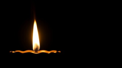 A golden oil lamp glows warmly against a dark backdrop, its flickering flame creating a cozy atmosphere.