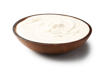 Delicious sour cream in wooden bowl isolated on white