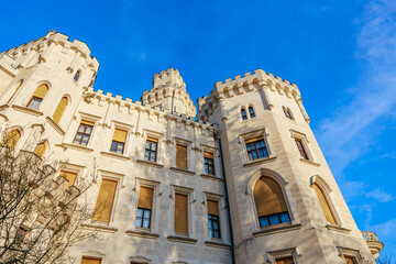 Fototapeta premium Majestic medieval castle against blue sky with gothic architecture